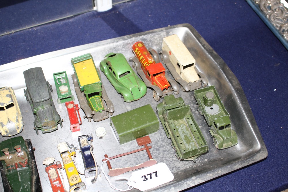 A group of assorted tinplate and diecast cars including Britains, Dinky and Tootsie